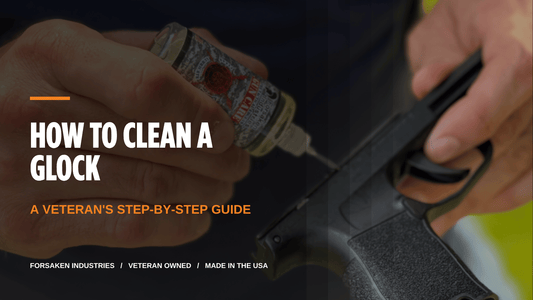 How to clean a Glock: Forsaken Industries CLP needle bottle being applied to a pistol slide