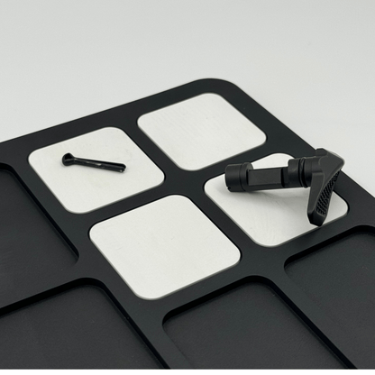 Forsaken Industries Magnetic Gun Cleaning Mat securing small firearm components during maintenance