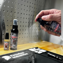 Applying Forsaken Industries Carbon Cleaner 4oz pump bottle to pistol components and gun cleaning mat for deep carbon removal