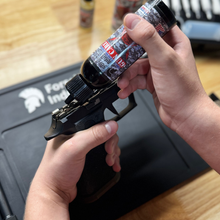 Close-up of 4 oz CLP bottle designed for gun maintenance and rust prevention